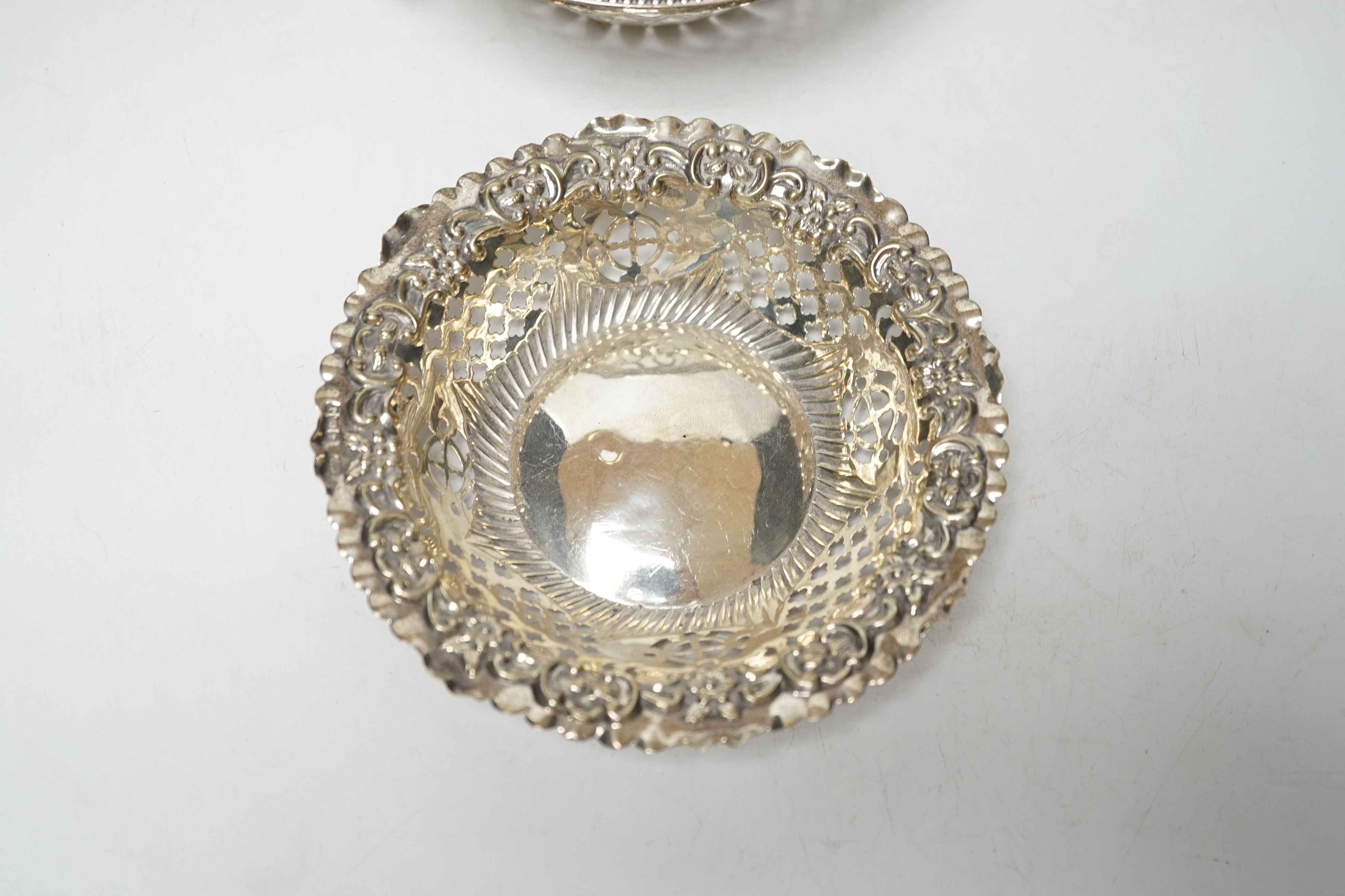 A pair of George VI pierced silver pedestal bon bon dishes, Viners Ltd, Sheffield, 1947, 11.7cm and three other assorted silver bonbon dishes, one with ring handles.